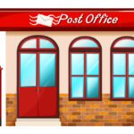 A red post office with two windows and a mailbox.