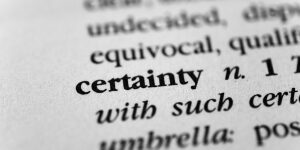 A close up of the word certainty in a dictionary