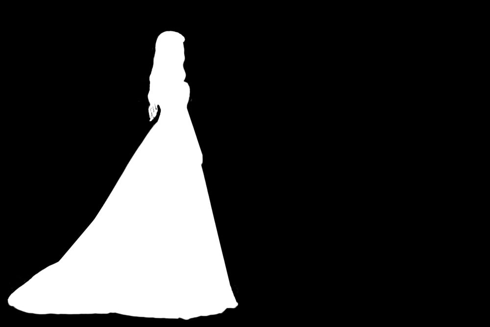 Silhouettes of girls in evening dress on a black background.