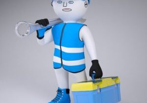 A toy man holding a wrench and carrying a tool box.