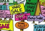 A bunch of yard sale signs that are all different colors